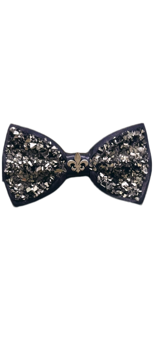 Shattered Elegance bow tie – abstract patterned satin bow tie with a central fleur-de-lis, merging modern art with classic symbols.